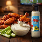 Atomic Chicken Blue Cheese Sauce — hot buffalo wings with a bowl of creamy blue cheese dip and celery