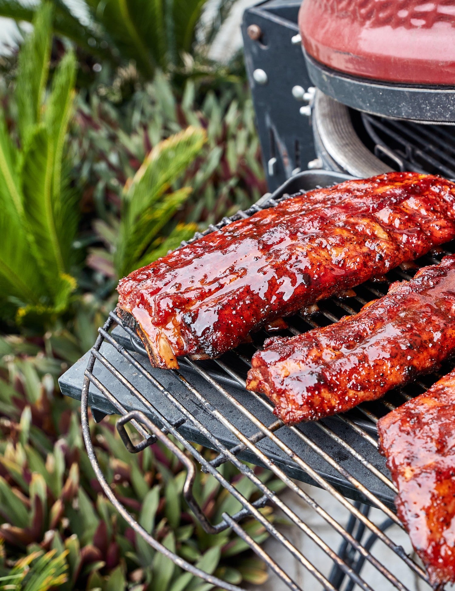 Barbecue Like a Boss by Adam Roberts hardback cookbook — glazed pork ribs on a kamado grill