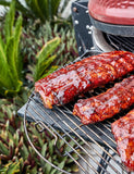 Barbecue Like a Boss by Adam Roberts hardback cookbook — glazed pork ribs on a kamado grill