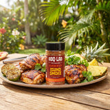 BBQ Lab Island Smoke citrus BBQ rub — jar with grilled chicken, lime and pineapple