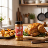 BBQ Lab True Blend seasoning salt — jar beside a golden roast chicken and roast potatoes