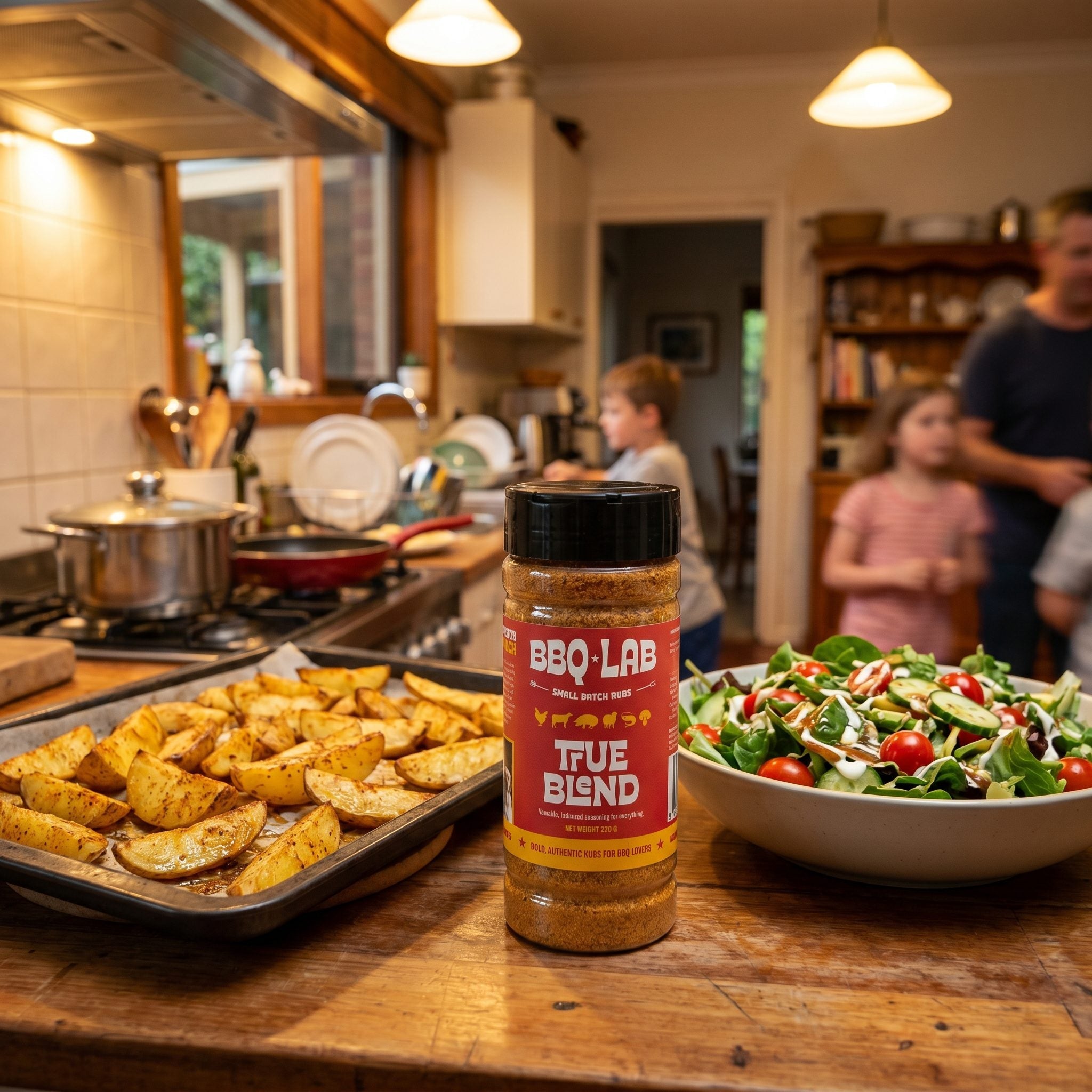 BBQ Lab True Blend seasoning salt — jar on a family kitchen bench with seasoned wedges