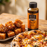 Barbecue Mafia Smoky Hot Honey — hot honey drizzled over crispy pork belly bites and pizza