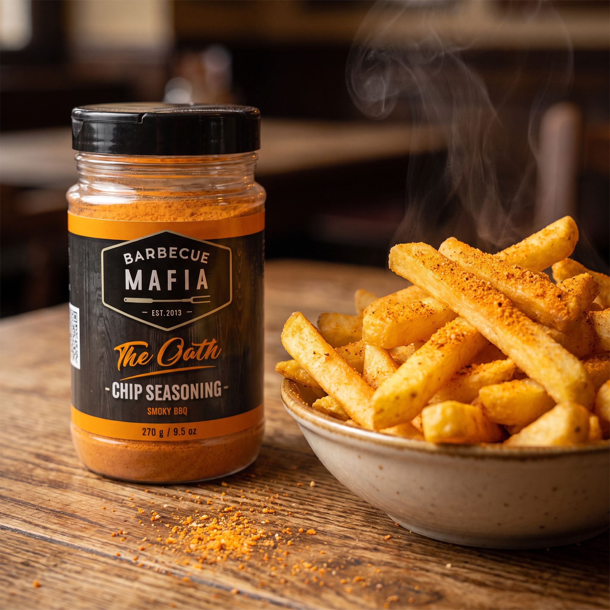 Barbecue Mafia The Oath Chip Seasoning 270g — a bowl of golden chips dusted with the seasoning beside the jar