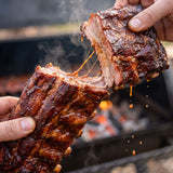 Barbecue Mafia The Squealer BBQ Rub — pork ribs pulled apart with sticky strands tearing