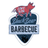 BlackBear BBQ barbecue brand logo, blue shield crest with pig and bear, on transparent background