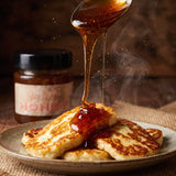 Blend Smoked Honey 250g — smoked honey drizzling over golden pan-fried halloumi