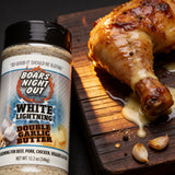 Close-up of roast chicken drumstick with melted garlic butter drip, seasoned with Boars Night Out Double Garlic Butter