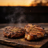 Butcher BBQ Grilling Addiction seasoned chargrilled burger and pork chop close-up