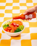 ChamCham Hot Bae Korean pear hot sauce being poured