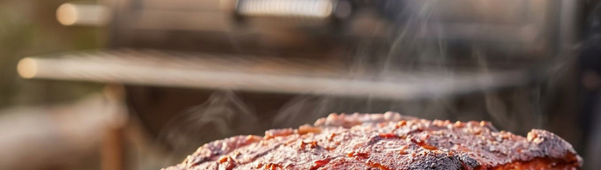 Coast n Smoke South West Rub 180g banner — smoked pork shoulder resting on an outdoor offset smoker