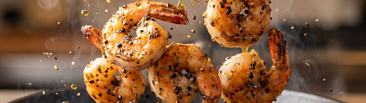 Coast n Smoke SPG Salt Pepper Garlic Seasoning Rub 170g banner — chargrilled prawns mid-toss in a pan
