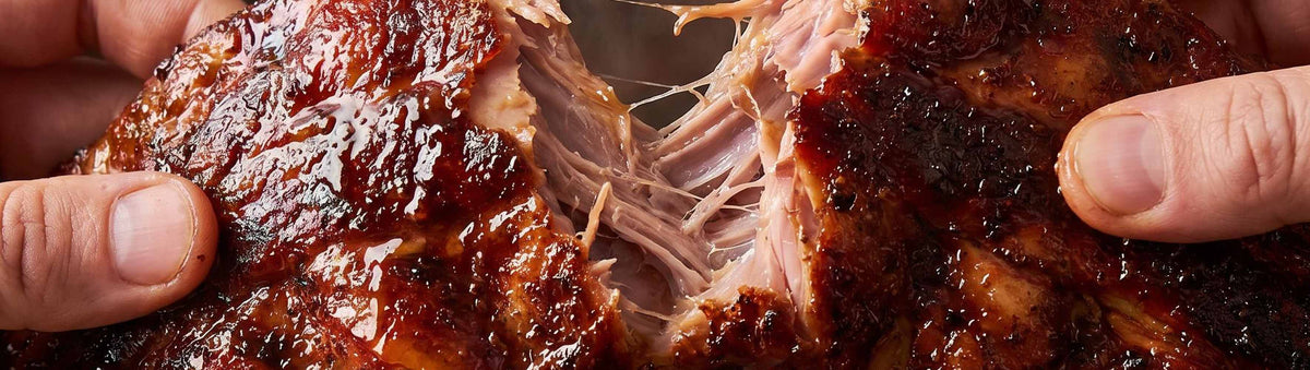 Coast n Smoke The Rip Rub 200g banner — smoked pork ribs pulled apart by hand, glossy bark