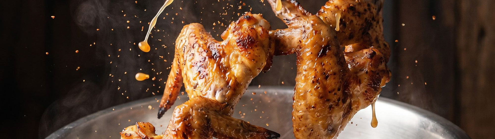 Coast n Smoke Winki-POP Dust 170g seasoning rub banner — golden chargrilled chicken wings mid-toss