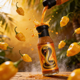 Cobra Chilli Blazing Saddles Chilli Sauce Medium 250ml Hot Sauce — dynamic Scotch Bonnet splash action shot