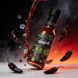 Cobra Chilli Congo B Pepper Sauce Ultra Hot 150ml hot sauce — dynamic action shot with Congo Black chillies