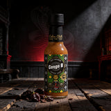 Cobra Chilli Congo B Pepper Sauce Ultra Hot 150ml hot sauce — styled hero shot in Cobra Chilli's gothic-western brand setting