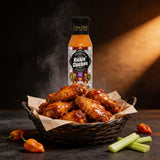 Cobra Chilli Kickin' Chicken Wing Sauce Hot 250ml hot sauce — coating a basket of buffalo-style chicken wings