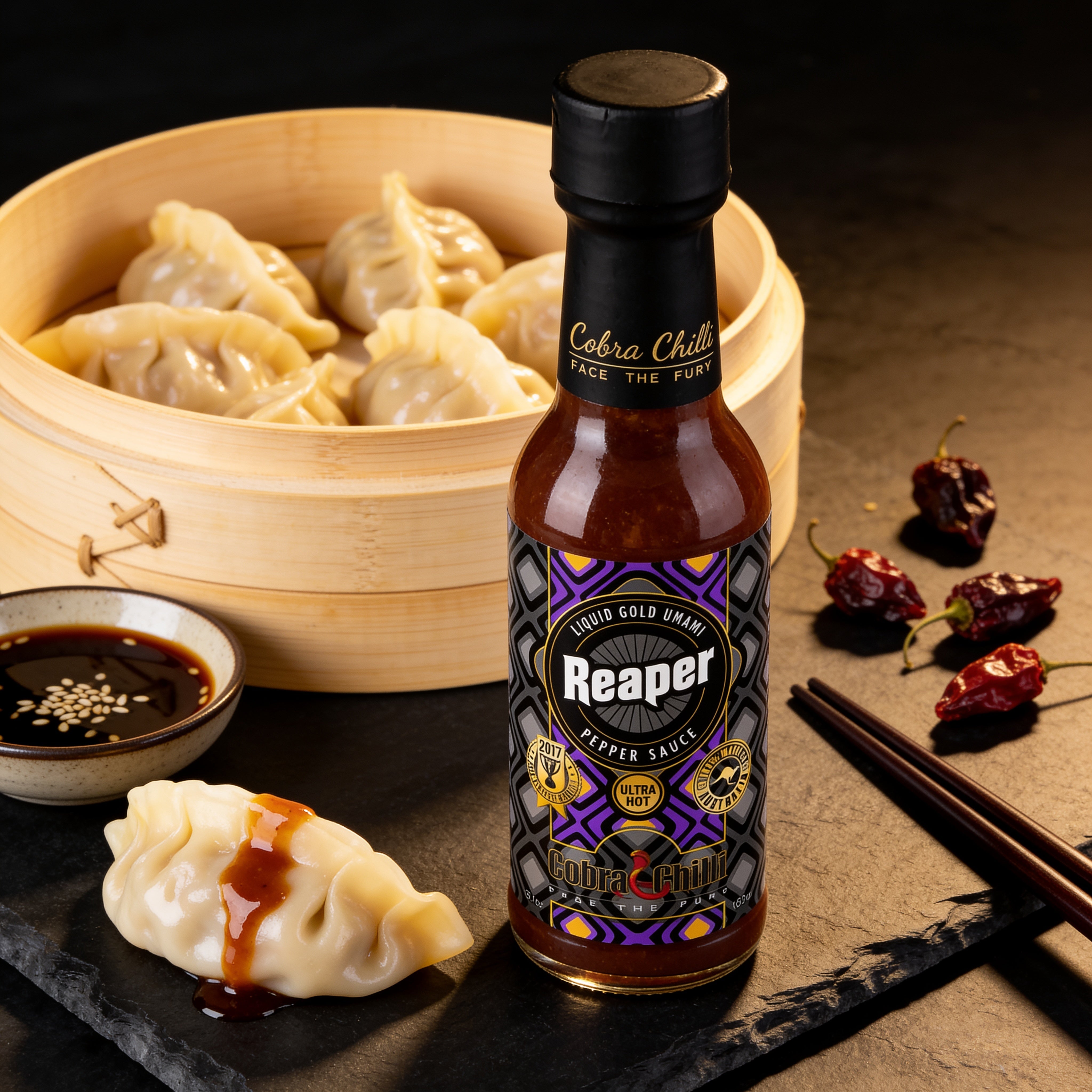 Cobra Chilli Reaper Magic Sauce Ultra Hot 150ml condiment — drizzled over steamed dumplings