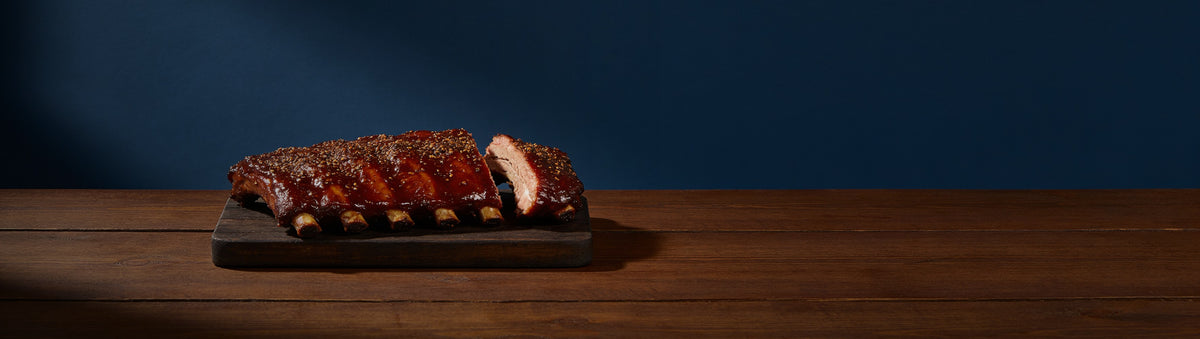 The First Mate banner — sliced sticky pork spare ribs on a timber board