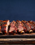 The First Mate lifestyle — sliced sticky pork spare ribs on a timber board