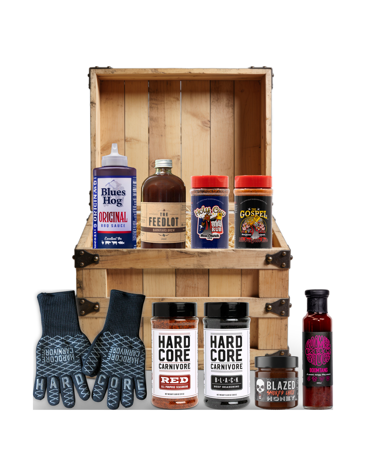 The Rub Hub The Kingpin BBQ subscription box — example crate with Blues Hog, The Feedlot, Meat Church, Hardcore Carnivore rubs and gloves, BLEND honey and Boomtang — contents change monthly, on transparent background
