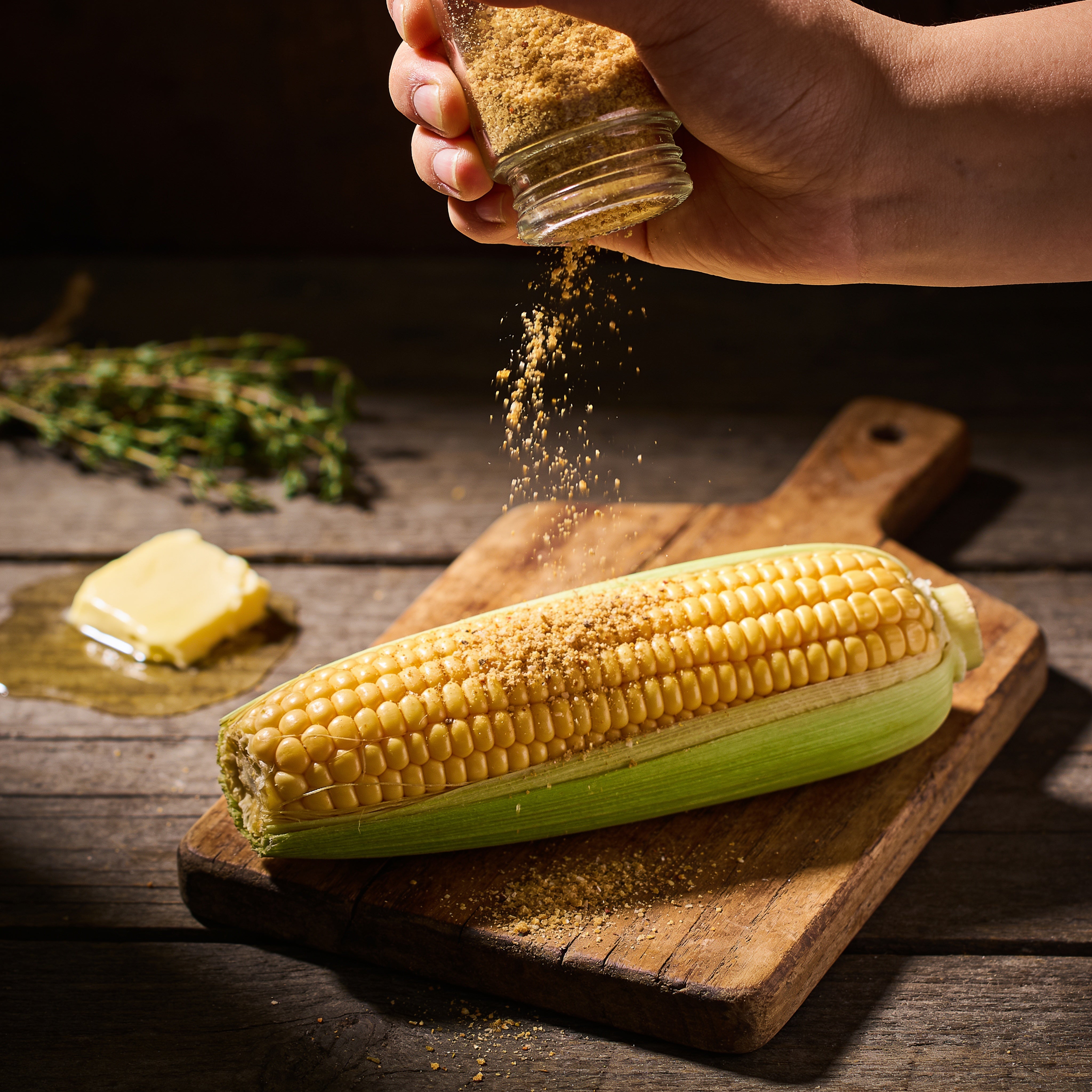 Smokes Seasoning Cowboy Butter Ranch sprinkled as a seasoning over corn on the cob