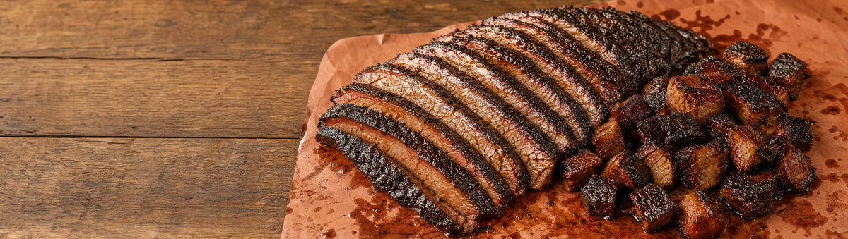Glazed brisket and burnt ends on a competition-style table