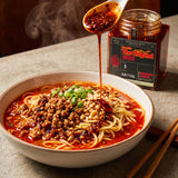 DC Cartel 1983 Extra Hot crispy chilli oil spooned over a bowl of dan dan noodles