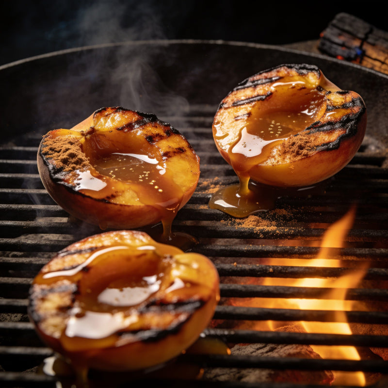Grilled peach halves with cinnamon-spiced caramel drizzle over hot coals — Dessert category lifestyle scene lifestyle photo
