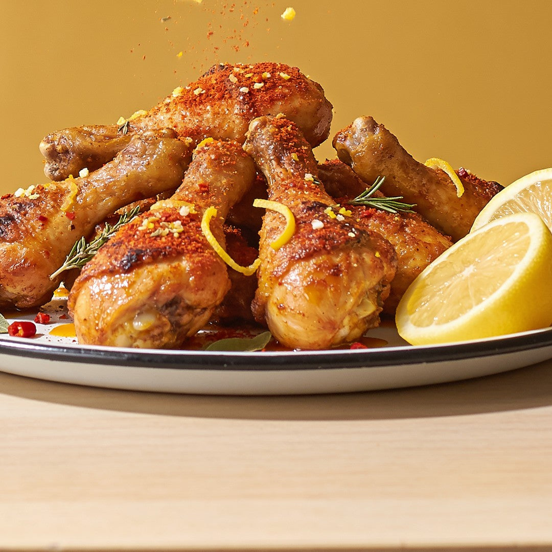 Citrus-crusted chicken drumsticks seasoned with Ember Republic Leopard Veldfire Citrus