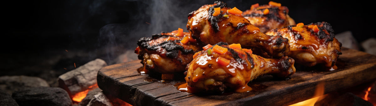 Fancy Hank's Habanero & Carrot Hot Sauce banner - grilled chicken thighs glazed with habanero carrot sauce