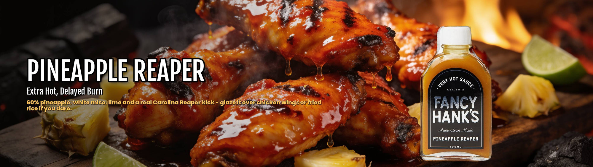 Fancy Hank's Pineapple Reaper Hot Sauce banner - fiery glazed chicken wings with pineapple and lime