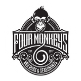 Four Monkeys BBQ brand logo, mohawk ape crest over a rubs and seasonings banner, black on transparent background