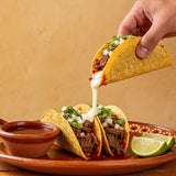 Four Saucemen Birria Taco Seasoning - birria tacos with a long cheese pull, consommé for dipping and lime