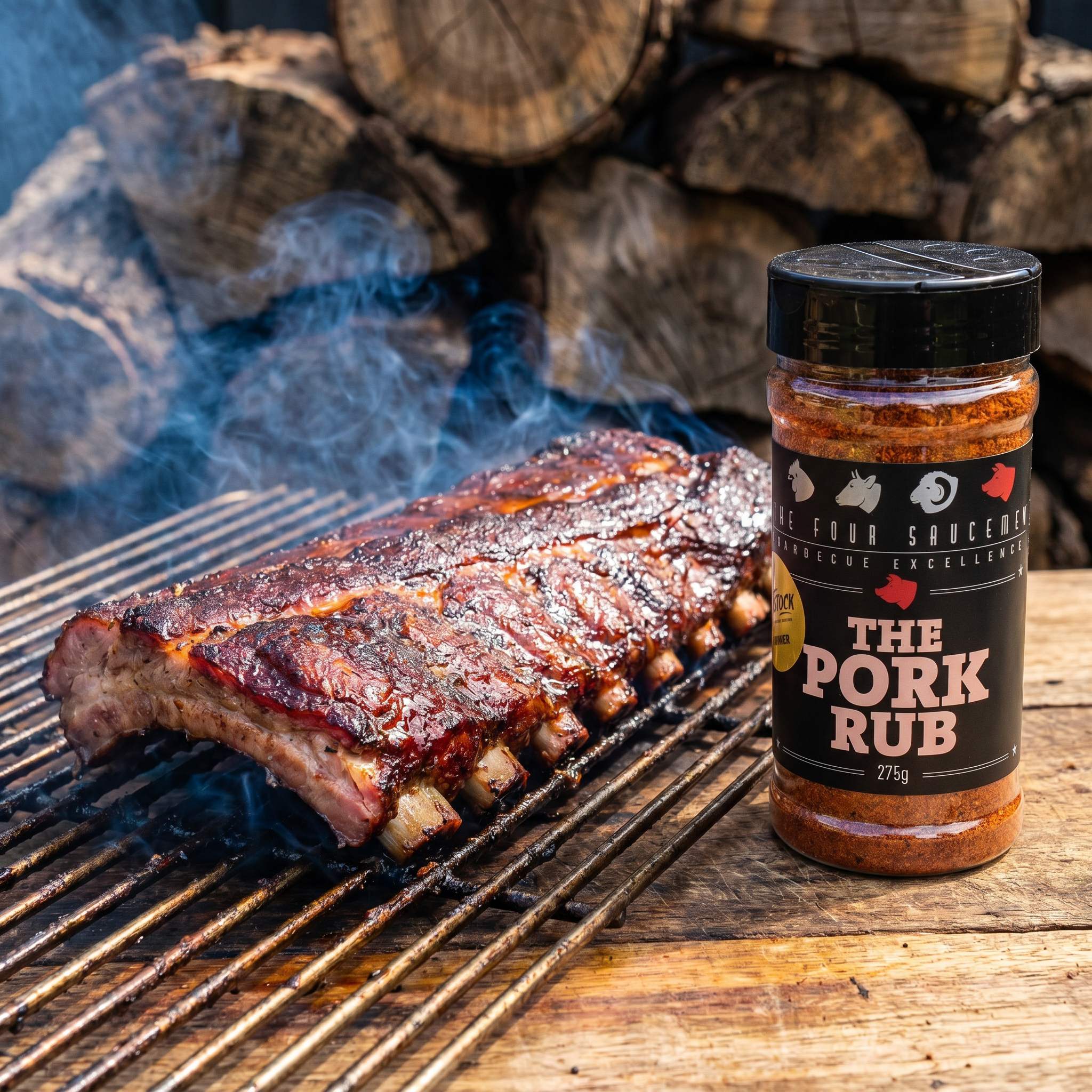 Four Saucemen The Pork Rub - rack of pork ribs with dark bark on the smoker