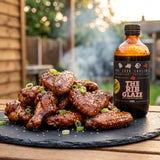 Four Saucemen The Rib Glaze - sticky glazed chicken wings on a slate board