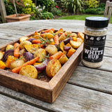 Four Saucemen The White Rub - tray of golden roasted potatoes and vegetables