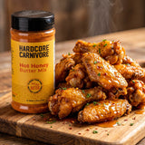 Hardcore Carnivore Hot Honey Butter Mix — glossy hot-honey glazed wings beside the pack
