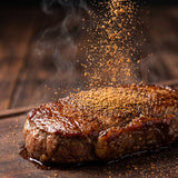 Hardcore Carnivore MeatyMite All-Purpose Rub — savoury umami rub sprinkled over a seared steak