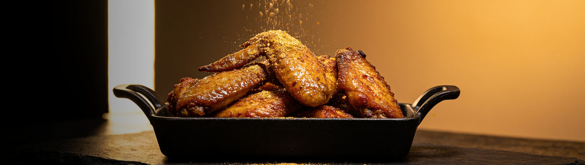 Heavenly Hell — Crispy chicken wings dusted with golden buttery finishing dust