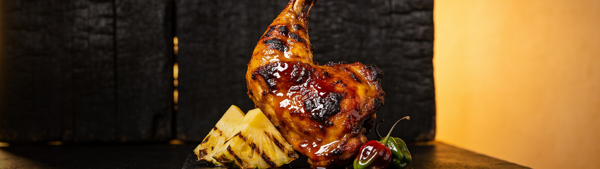 Heavenly Hell — Jerk chicken glazed in spiced rum hot sauce with pineapple