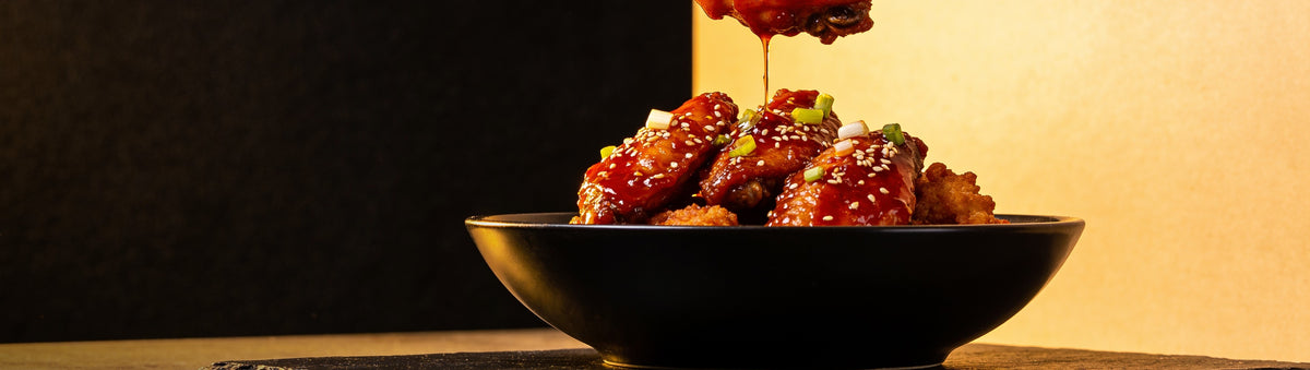 Heavenly Hell — Sticky Korean chicken wings with sesame and spring onion