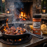 Elk Creek Cajun Stinger seasoning — blackened Cajun prawns sizzling in a cast-iron skillet