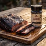 Rum and Que Blackout beef rub 220g — sliced smoked brisket with a dark savoury bark on a board