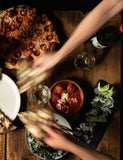 The Joy of Pizza by Dan Richer & Katie Parla hardback cookbook — table of Razza pizzas being shared