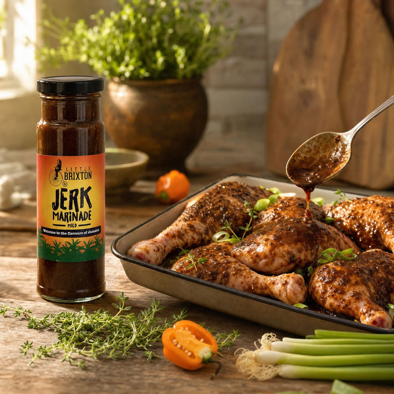 Little Brixton Jerk Marinade — chicken being marinated, bottle beside lifestyle photo