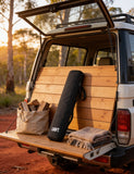 Looftlighter carry case packed in a ute at a bush campsite with firewood