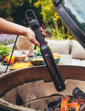 Looftlighter Pro in use lighting charcoal in a kamado on a garden patio