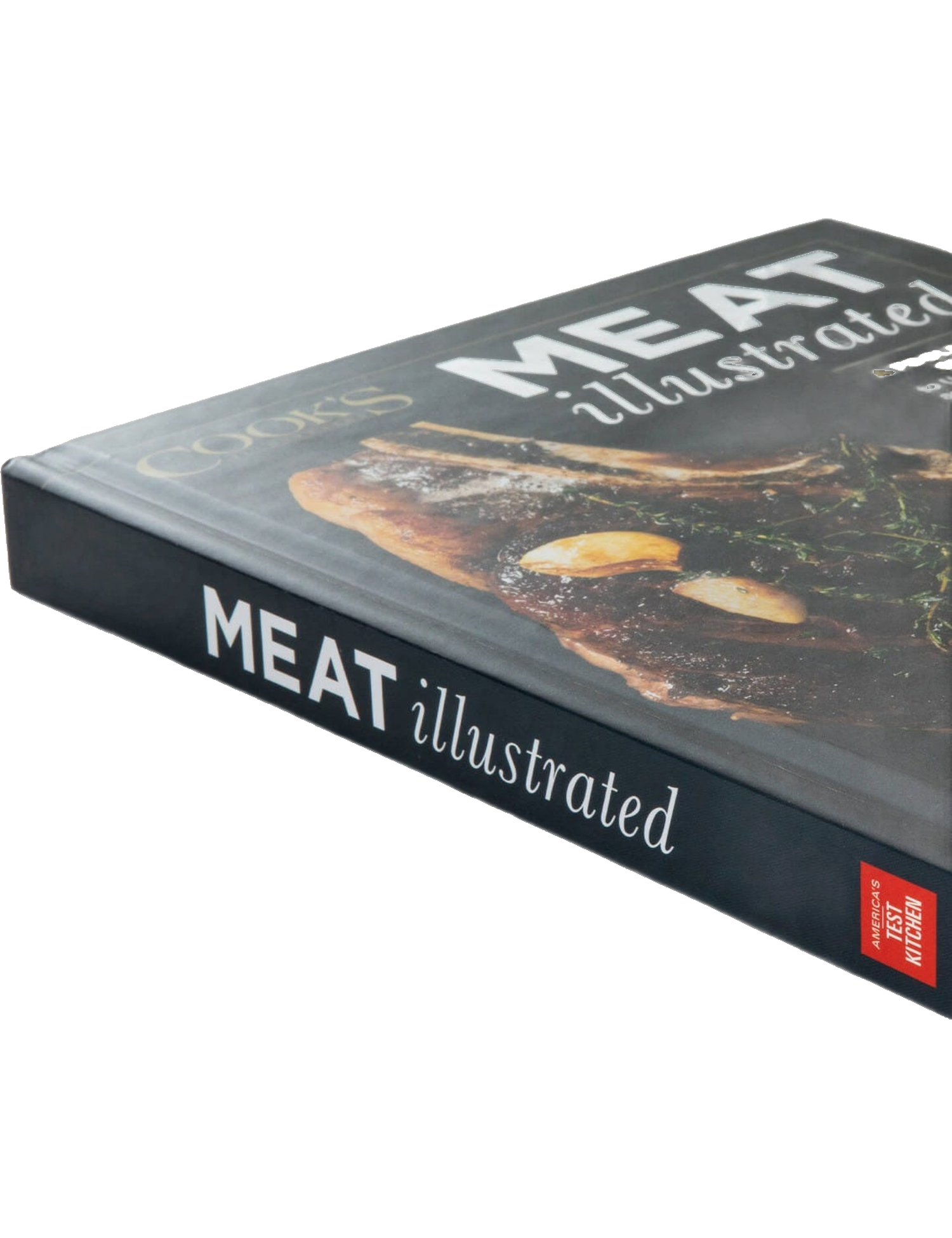 Meat Illustrated by America's Test Kitchen hardback cookbook — angled view of the book showing the spine